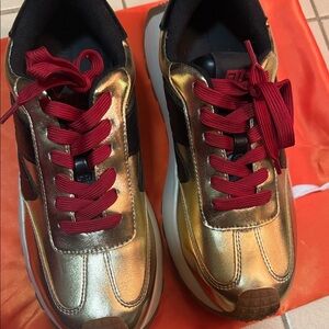 Steve Madden Gold and Black Sneakers with Red Laces